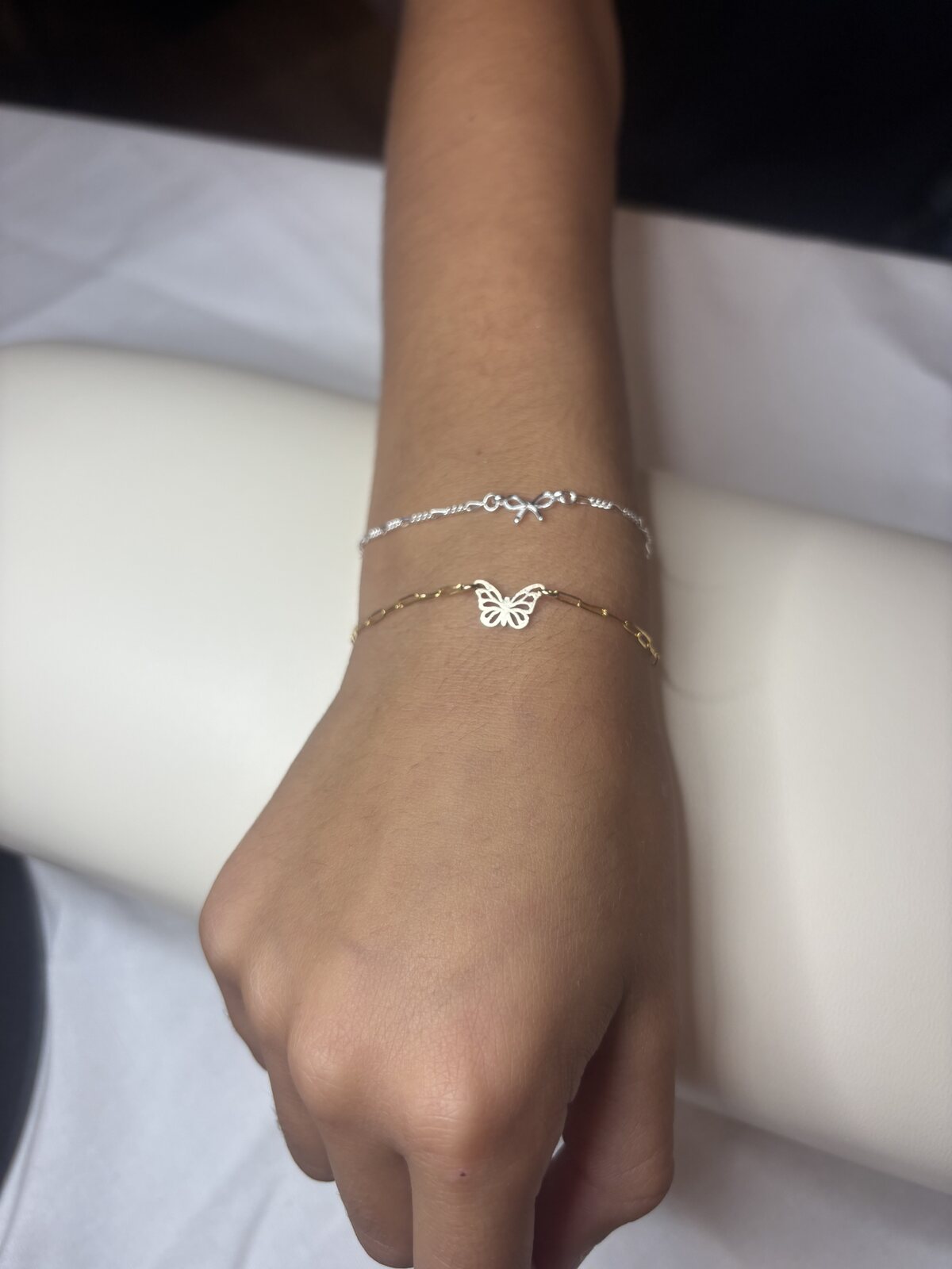 Close-up of a butterfly charm bracelet