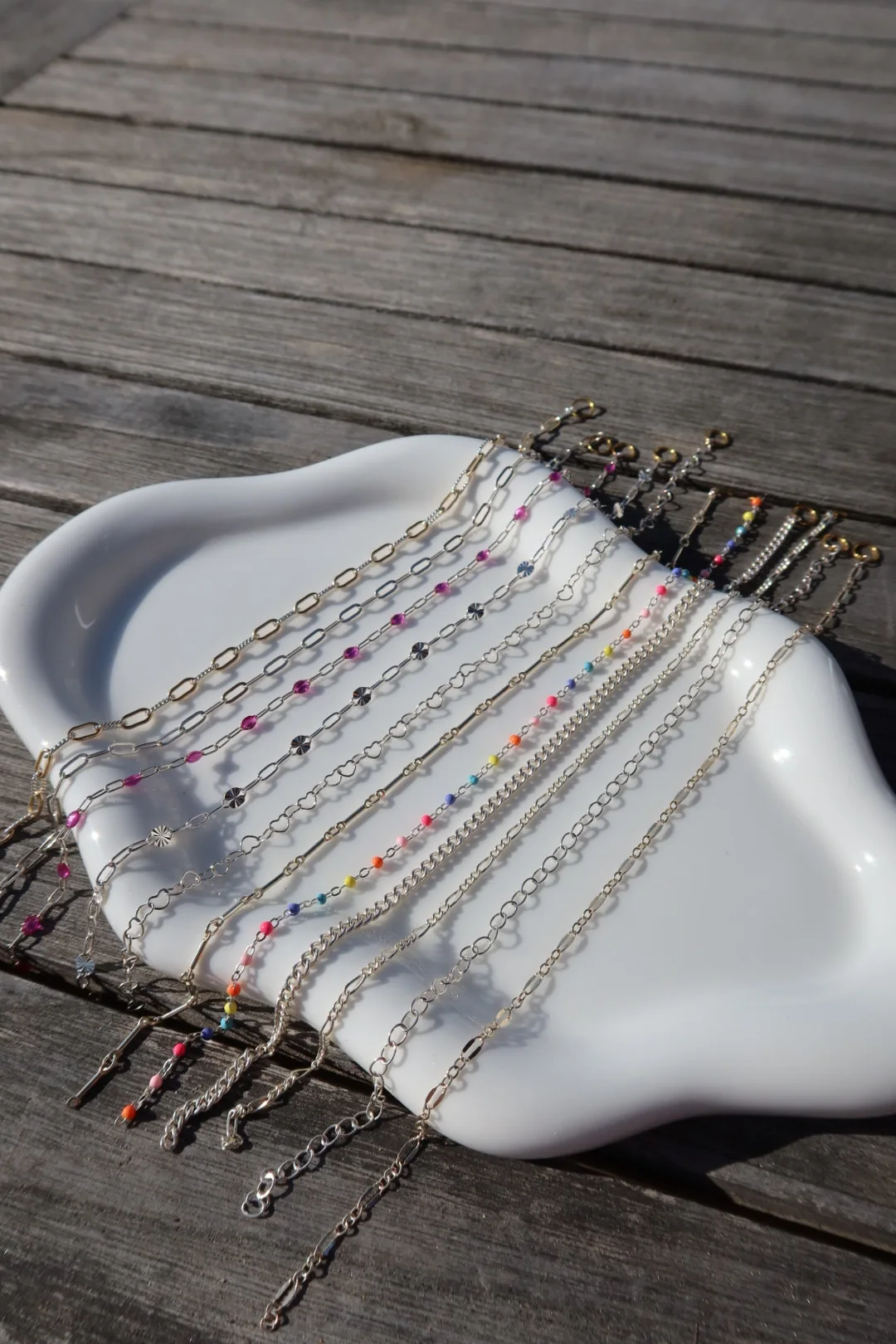 Close view of sterling silver chain styles with colorful details
