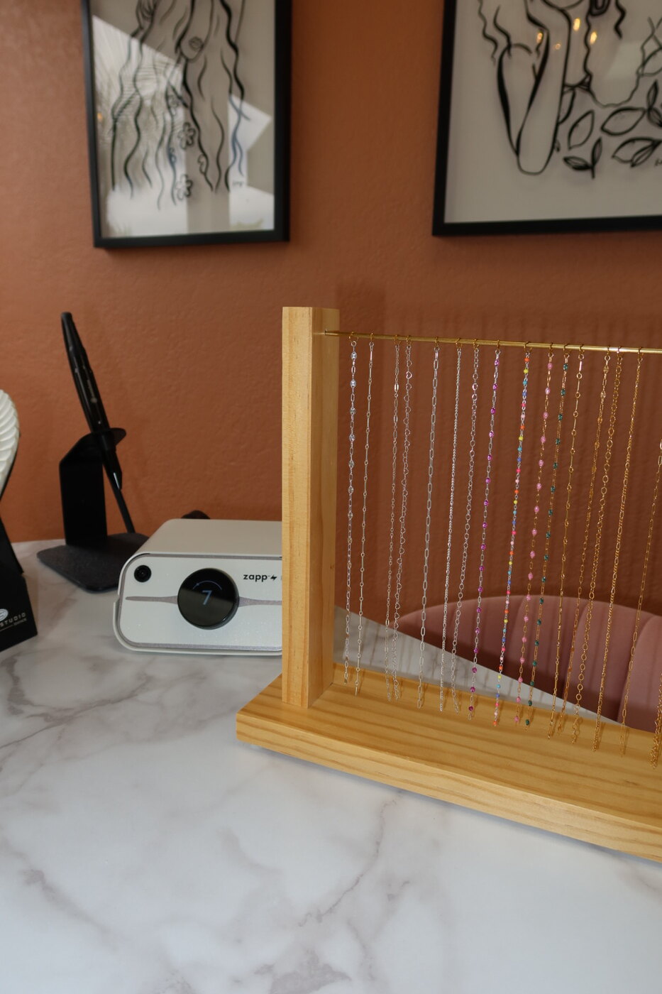 Close-up of the permanent jewelry chain display