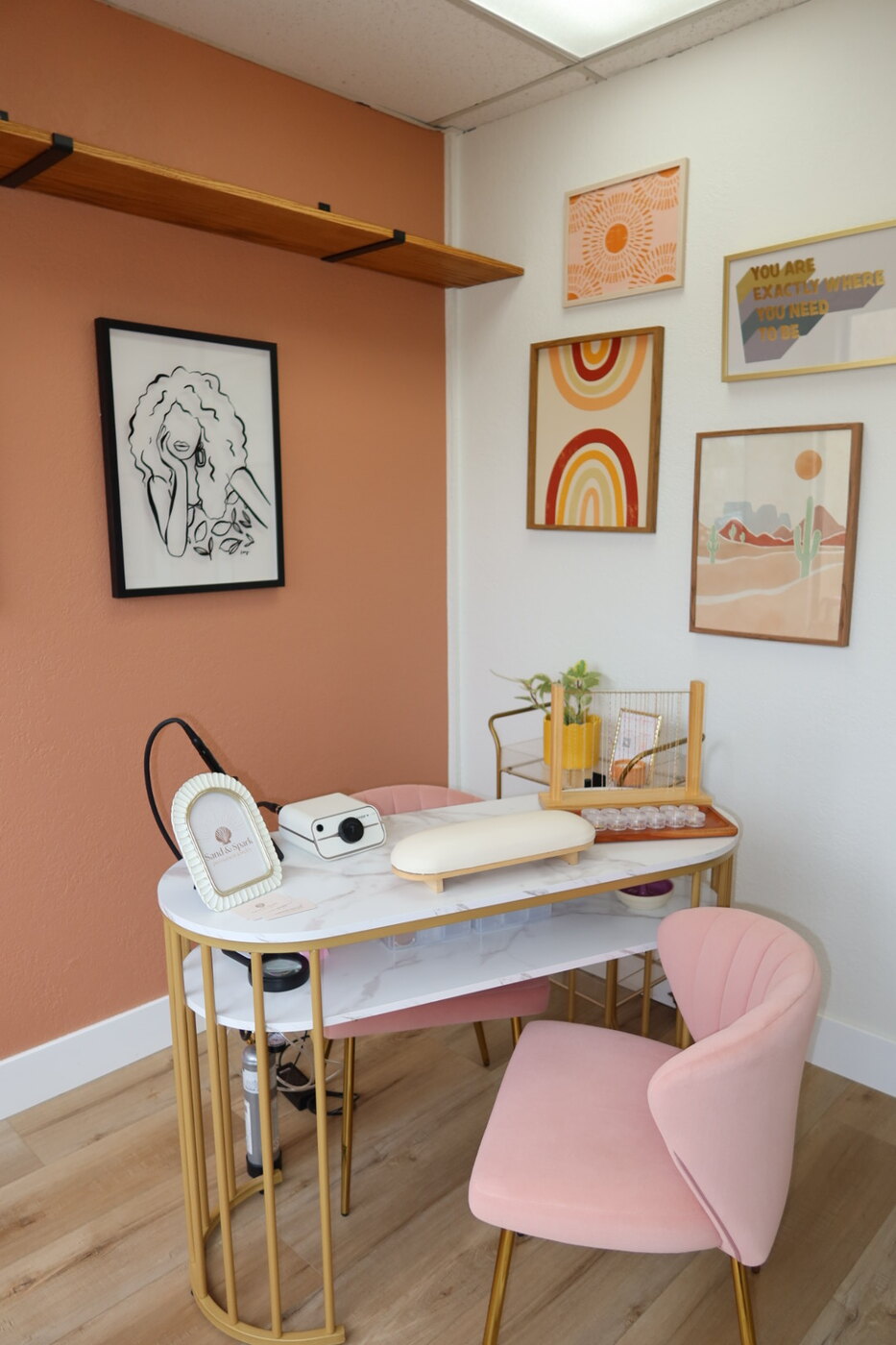 Pink seating and the jewelry fitting table inside the studio